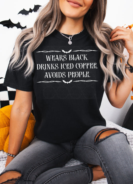 Wears Black Drinks Ice Coffee Avoids People