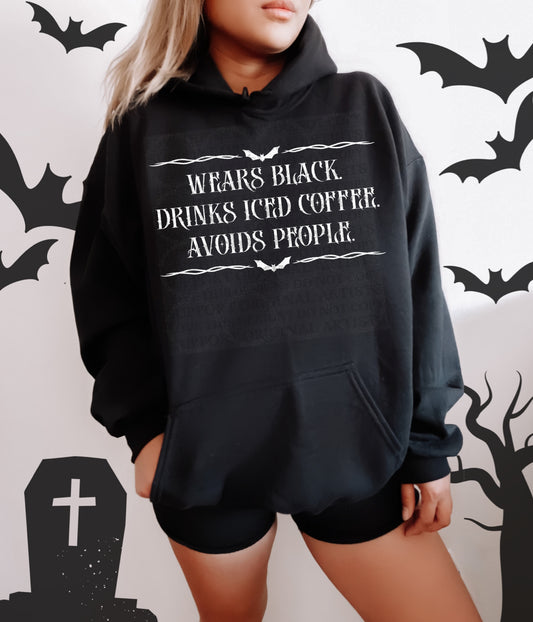 Wears Black Drinks Ice Coffee Avoids People